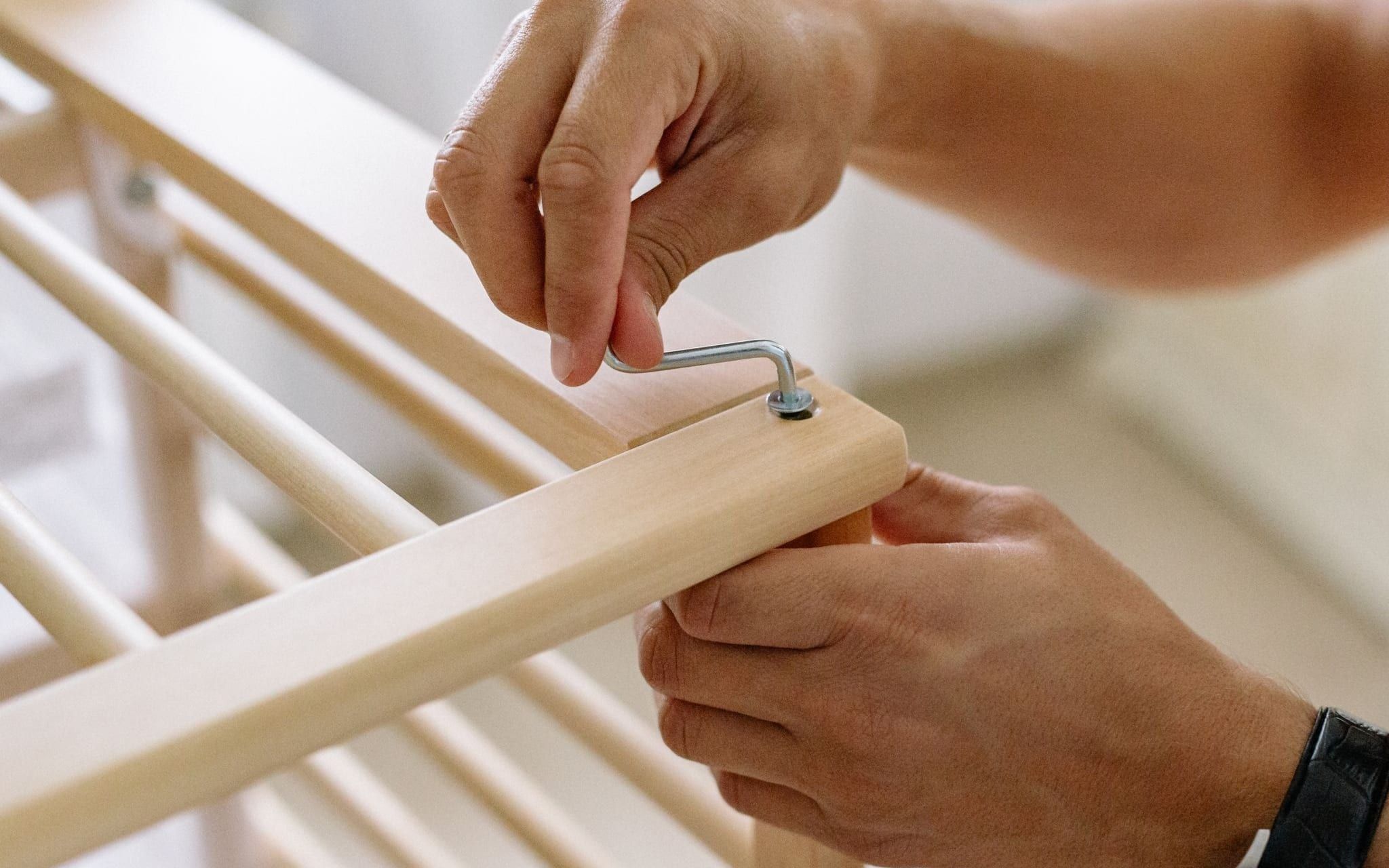 Assembling flat-pack furniture rails with an Allen key