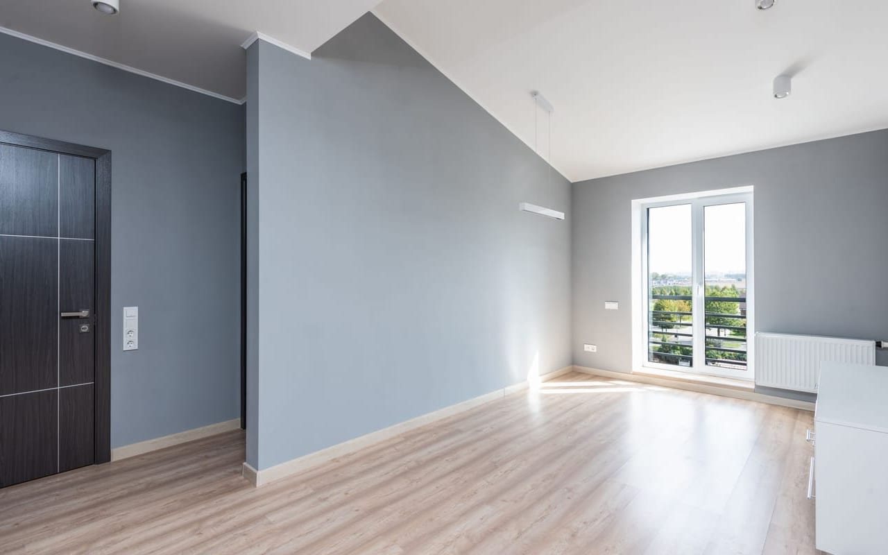 Repainted room with smooth gray walls and crisp white trim